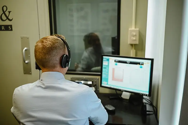 audiologist conducts a comprehensive hearing assessment